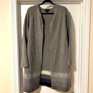 Long gray sweater with colored detail on bottom